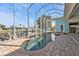 Screened-in pool area features a kidney shaped pool, hot tub, with brick pavers, and dock at 960 Messina Dr, Punta Gorda, FL 33950
