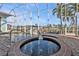 Screened-in pool area with hot tub, canal view and pavers at 960 Messina Dr, Punta Gorda, FL 33950