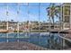 Relaxing pool with a view of the canal and palm trees through the screened lanai at 960 Messina Dr, Punta Gorda, FL 33950