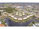 Aerial view of waterfront condos with manicured grounds, a pool, and convenient parking at 1080 Bal Harbor Blvd # 4D, Punta Gorda, FL 33950