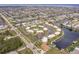 Aerial view of a waterfront condo community with a pool, marina, and private boat docks at 1080 Bal Harbor Blvd # 4D, Punta Gorda, FL 33950