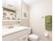 Clean bathroom featuring a vanity, mirror, and framed art at 1080 Bal Harbor Blvd # 4D, Punta Gorda, FL 33950