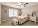 Well-lit bedroom with a ceiling fan at 1080 Bal Harbor Blvd # 4D, Punta Gorda, FL 33950
