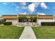 This condo features a well manicured lawn and tropical landscaping in front of the building at 1080 Bal Harbor Blvd # 4D, Punta Gorda, FL 33950