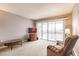 Comfortable living room featuring a balcony, perfect for enjoying the serene surroundings at 1080 Bal Harbor Blvd # 4D, Punta Gorda, FL 33950