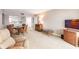 Open-concept living and dining area with access to the kitchen and sliding door to the balcony at 1080 Bal Harbor Blvd # 4D, Punta Gorda, FL 33950