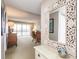 Inviting living room with a large mirror and sliding glass doors leading to a balcony at 1080 Bal Harbor Blvd # 4D, Punta Gorda, FL 33950