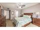 Comfortable main bedroom with ensuite bath and ceiling fan at 1080 Bal Harbor Blvd # 4D, Punta Gorda, FL 33950