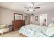 Cozy main bedroom features a ceiling fan at 1080 Bal Harbor Blvd # 4D, Punta Gorda, FL 33950