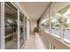 This screened in patio has tile floors, a small table with two chairs, and views of the water at 1080 Bal Harbor Blvd # 4D, Punta Gorda, FL 33950