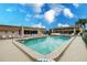 Inviting community pool with clear blue water and ample seating for residents to enjoy at 1080 Bal Harbor Blvd # 4D, Punta Gorda, FL 33950