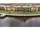 Exterior view of condos overlooking water with a dock at 1080 Bal Harbor Blvd # 4D, Punta Gorda, FL 33950