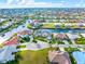 Aerial view showcases a desirable waterfront property with access to canals in a residential community at 1105 Rum Cay Ct, Punta Gorda, FL 33950