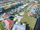Aerial view of a circle street full of homes, tropical landscaping, waterfront community at 1105 Rum Cay Ct, Punta Gorda, FL 33950