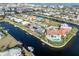 Beautiful aerial image of a waterfront property, complete with a pool and access to the canal system at 1105 Rum Cay Ct, Punta Gorda, FL 33950