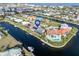 Stunning aerial view of a waterfront neighborhood on interconnected canals, offering boat access and scenic views at 1105 Rum Cay Ct, Punta Gorda, FL 33950