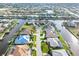 Waterfront homes line the canal, view from above, showcasing tropical landscaping and beautiful neighborhood at 1105 Rum Cay Ct, Punta Gorda, FL 33950