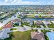An impressive aerial view of a waterfront neighborhood, showing homes with boat docks and canal access at 1105 Rum Cay Ct, Punta Gorda, FL 33950