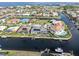 Scenic aerial showcasing homes with private docks, offering easy access to open water and stunning waterfront living at 1105 Rum Cay Ct, Punta Gorda, FL 33950