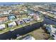 Expansive aerial view of waterfront homes with private docks along canals, offering beautiful landscaping at 1105 Rum Cay Ct, Punta Gorda, FL 33950