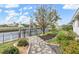 A stone path leads to a fenced canal with a boat lift at 1105 Rum Cay Ct, Punta Gorda, FL 33950