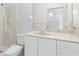 Bathroom with a single sink, white cabinetry, and a shower with white fixtures at 1105 Rum Cay Ct, Punta Gorda, FL 33950
