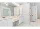 Bright bathroom with double sinks and a large mirror at 1105 Rum Cay Ct, Punta Gorda, FL 33950