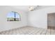 Unfurnished room features an arched window, tile floors, and closet at 1105 Rum Cay Ct, Punta Gorda, FL 33950