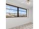 Bedroom with black window looking out to a sunny landscape at 1105 Rum Cay Ct, Punta Gorda, FL 33950