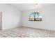 Unfurnished room features an arched window, tile floors, and closet at 1105 Rum Cay Ct, Punta Gorda, FL 33950