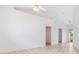 Open unfurnished bedroom with walk in closet, tile flooring, bright walls, and a patio at 1105 Rum Cay Ct, Punta Gorda, FL 33950