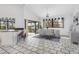 Bright dining room with water views, stone floors, and modern table set is perfect for Gathering gatherings at 1105 Rum Cay Ct, Punta Gorda, FL 33950