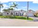 Stunning single-story house boasts mature palm trees, a well-kept lawn, and an attached garage at 1105 Rum Cay Ct, Punta Gorda, FL 33950