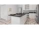 Bright kitchen featuring a kitchen island, stainless steel appliances, and white cabinets at 1105 Rum Cay Ct, Punta Gorda, FL 33950
