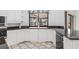 Bright kitchen featuring a sink, white cabinets, and granite countertops at 1105 Rum Cay Ct, Punta Gorda, FL 33950