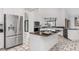 Bright kitchen featuring stainless steel appliances, granite countertops, and a kitchen island at 1105 Rum Cay Ct, Punta Gorda, FL 33950