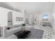 Bright living room featuring an office area, stylish decor, and tile flooring at 1105 Rum Cay Ct, Punta Gorda, FL 33950