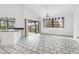 Bright living room featuring water views, tile flooring, and a breakfast bar at 1105 Rum Cay Ct, Punta Gorda, FL 33950