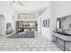 Spacious living area with tile flooring, a high ceiling, and access to the screened-in patio at 1105 Rum Cay Ct, Punta Gorda, FL 33950