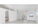 Bright living room featuring arched doorways, tile flooring, and a ceiling fan at 1105 Rum Cay Ct, Punta Gorda, FL 33950