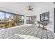 This screened patio features tile floors, a ceiling fan, wet bar, and views of the canal at 1105 Rum Cay Ct, Punta Gorda, FL 33950