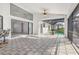 Spacious patio featuring tiled floors and a gorgeous view of the backyard and the inviting pool area at 1105 Rum Cay Ct, Punta Gorda, FL 33950