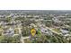Aerial view of a home nestled within a community and surrounded by trees at 1117 Vernon Ave, Port Charlotte, FL 33948