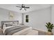 Bright, neutral bedroom with a comfortable bed, soft lighting, and a calming atmosphere at 1117 Vernon Ave, Port Charlotte, FL 33948