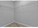 Walk-in closet with wire shelving and vinyl floors at 1117 Vernon Ave, Port Charlotte, FL 33948
