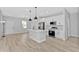 Bright open kitchen with stainless appliances, island, and stylish pendant lighting at 1117 Vernon Ave, Port Charlotte, FL 33948