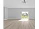 Spacious living room with sliding glass doors providing a great view of the yard at 1117 Vernon Ave, Port Charlotte, FL 33948