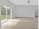Spacious open concept living room with large sliding glass doors to backyard at 1117 Vernon Ave, Port Charlotte, FL 33948