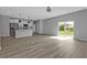 Open-concept living room area that looks to the kitchen and the backyard at 1117 Vernon Ave, Port Charlotte, FL 33948