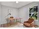 Bright office with large window, desk, lamp, and stylish seating for a comfortable work environment at 1117 Vernon Ave, Port Charlotte, FL 33948
